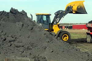 wood ash being loaded thumb - Spotlight on Cotton Growers